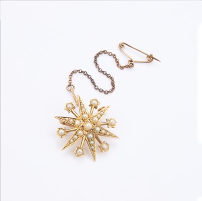 Lot 778 - A VICTORIAN 15-CARAT GOLD SEED PEARL SET STAR BROOCH