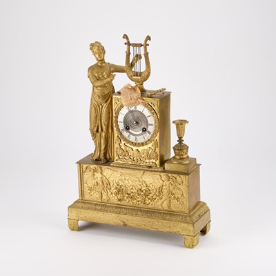 Lot 868 - A FRENCH GILT-METAL MANTEL CLOCK