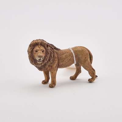 Lot 917 - A COLD-PAINTED BRONZE OF A LION