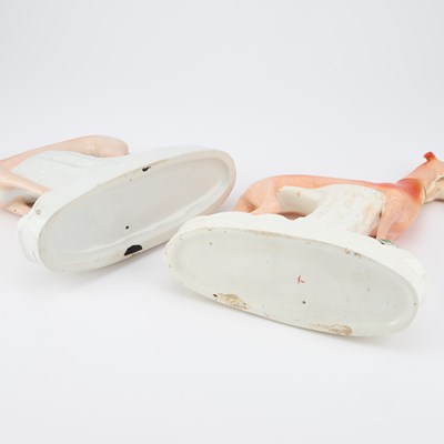 Lot 63 - A NEAR PAIR OF VICTORIAN STAFFORDSHIRE POTTERY MODELS OF GREYHOUNDS