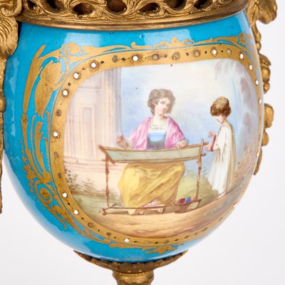 Lot 709 - A 19TH CENTURY FRENCH GILT-METAL AND PORCELAIN CLOCK GARNITURE