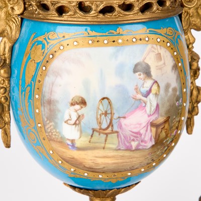 Lot 709 - A 19TH CENTURY FRENCH GILT-METAL AND PORCELAIN CLOCK GARNITURE