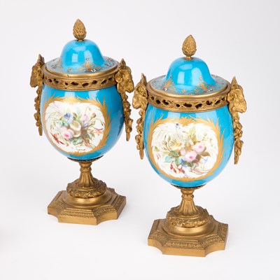 Lot 709 - A 19TH CENTURY FRENCH GILT-METAL AND PORCELAIN CLOCK GARNITURE