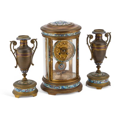 Lot 708 - A FRENCH CHAMPLEVÉ ENAMEL AND GILT-METAL CLOCK GARNITURE, CIRCA 1900