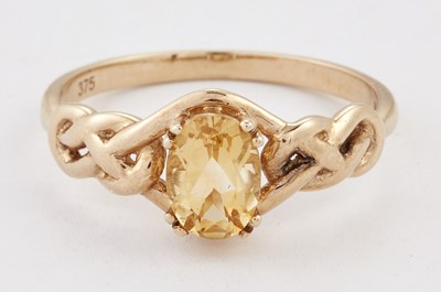 Lot 1612 - A 9 CARAT GOLD CITRINE RING