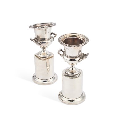 Lot 300 - A PAIR OF EDWARDIAN SILVER URNS ON INTEGRAL STANDS