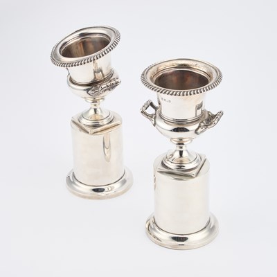 Lot 300 - A PAIR OF EDWARDIAN SILVER URNS ON INTEGRAL STANDS