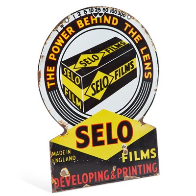 Lot 684 - A SELO FILMS 'THE POWER BEHIND THE LENS' ENAMEL ADVERTISING SIGN