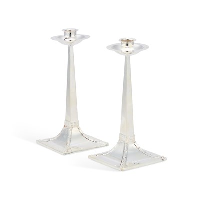 Lot 295 - A PAIR OF ARTS AND CRAFTS STYLE SILVER CANDLESTICKS