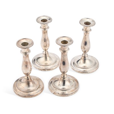 Lot 215 - A SET OF FOUR GEORGE III SILVER CANDLESTICKS