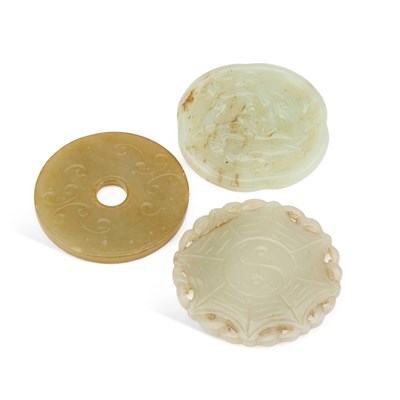 Lot 109 - THREE CHINESE CARVED JADE DISCS