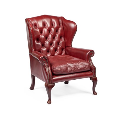 Lot 752 - A GEORGIAN STYLE DEEP-BUTTONED RED LEATHER WING-BACK ARMCHAIR