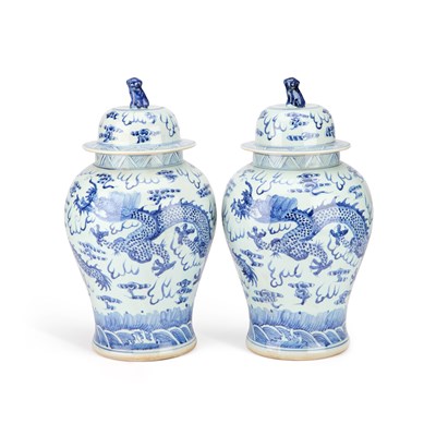 Lot 63 - A LARGE PAIR OF CHINESE BLUE AND WHITE 'DRAGON' VASES AND COVERS