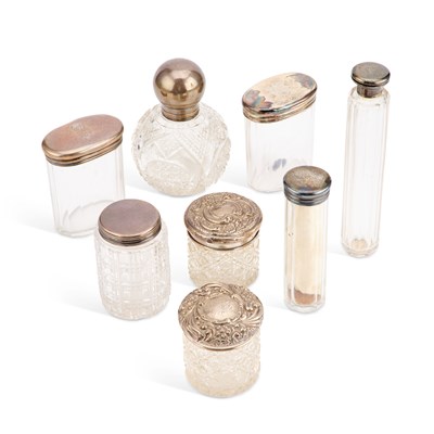 Lot 268 - A MIXED LOT OF SILVER-TOPPED GLASS JARS AND BOTTLES