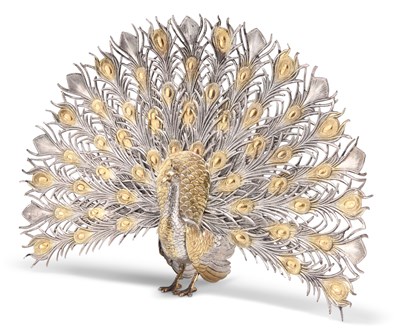 Lot 1318 - A SILVER AND PARCEL-GILT PEACOCK MODEL