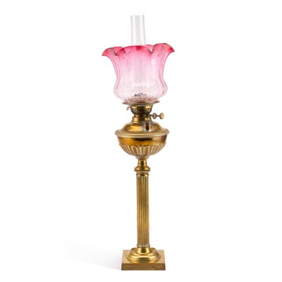 Lot 31 - A BRASS COLUMNAR OIL LAMP WITH RUBY TINTED GLASS SHADE