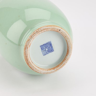 Lot 162 - A CHINESE SLIP-DECORATED CELADON VASE