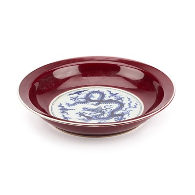 Lot 157 - A CHINESE UNDERGLAZE BLUE AND SANG-DE-BOEUF 'DRAGON' DISH