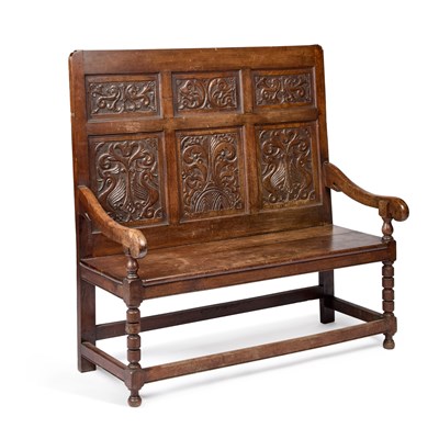 Lot 753 - A VICTORIAN CARVED OAK SETTLE