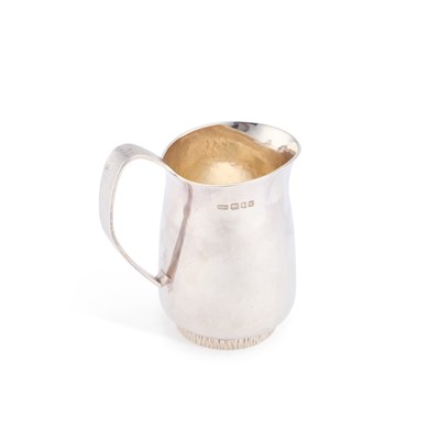 Lot 411 - AN ELIZABETH II SILVER CREAM JUG