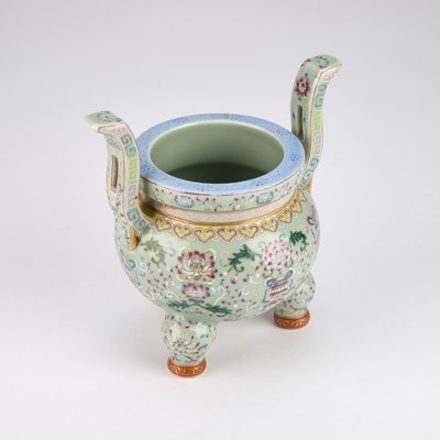 Lot 924 - A CHINESE FAMILLE ROSE 'BAJIXIANG' TWO-HANDLED TRIPOD CENSER