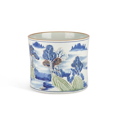 Lot 125 - A CARVED UNDERGLAZE-BLUE, COPPER-RED AND CELADON-GLAZED 'LANDSCAPE' BRUSH POT, BITONG