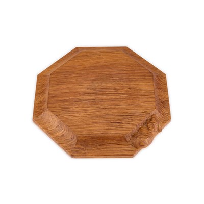 Lot 1356 - ROBERT THOMPSON OF KILBURN, A MOUSEMAN OAK TEAPOT STAND/ SMALL CHOPPING BOARD