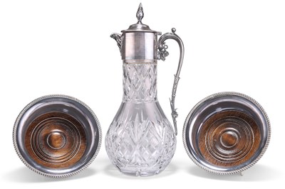 Lot 1002 - A VICTORIAN STYLE SILVER-PLATE MOUNTED CLARET JUG AND A PAIR OF GARRARD SILVER-PLATED WINE COASTERS