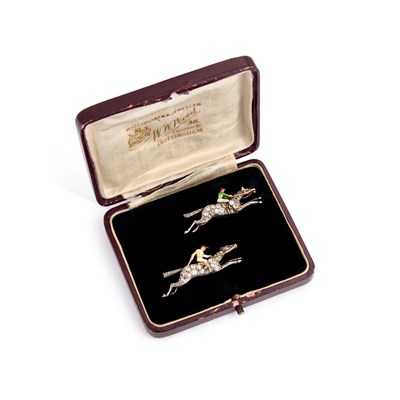 Lot A PAIR OF EARLY 20TH CENTURY DIAMOND AND ENAMEL JOCKEY BROOCHES