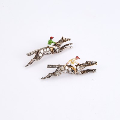 Lot A PAIR OF EARLY 20TH CENTURY DIAMOND AND ENAMEL JOCKEY BROOCHES