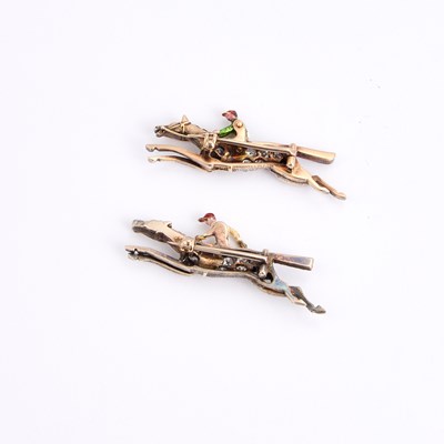 Lot A PAIR OF EARLY 20TH CENTURY DIAMOND AND ENAMEL JOCKEY BROOCHES