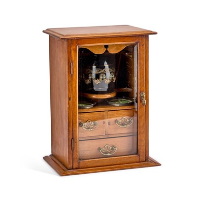 Lot 233 - AN EDWARDIAN OAK SMOKERS CABINET