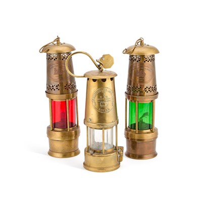 Lot 135 - THREE BRASS MINERS LAMPS