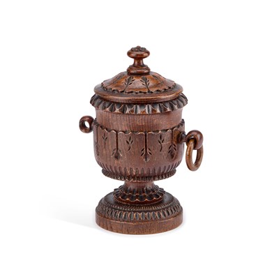 Lot 169 - A 19TH CENTURY CARVED OAK TOBACCO JAR AND COVER