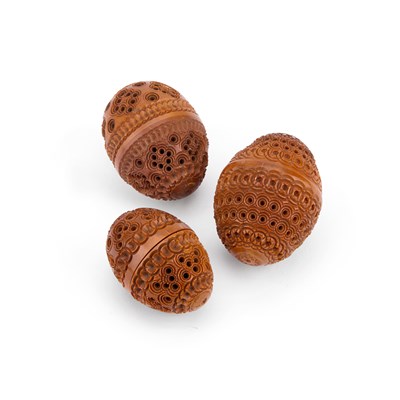 Lot 10 - THREE PIERCED AND CARVED COQUILLA NUTS