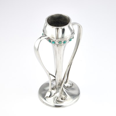 Lot ARCHIBALD KNOX (1864-1933) FOR LIBERTY & CO, A TUDRIC PEWTER AND FAUX TURQUOISE TULIP VASE