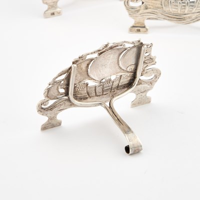 Lot 462 - OMAR RAMSDEN: AN SET OF FOUR ARTS AND CRAFTS SILVER MENU HOLDERS
