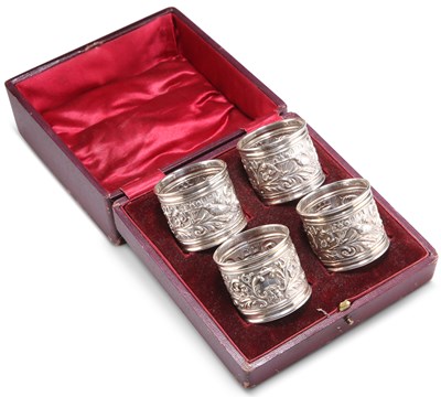 Lot 1356 - A SET OF FOUR LATE VICTORIAN SILVER NAPKIN RINGS