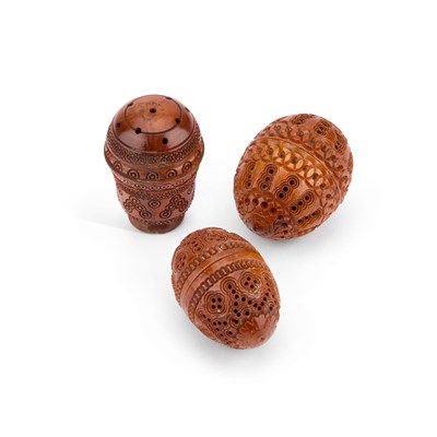 Lot 168 - THREE PIERCED AND CARVED COQUILLA NUTS