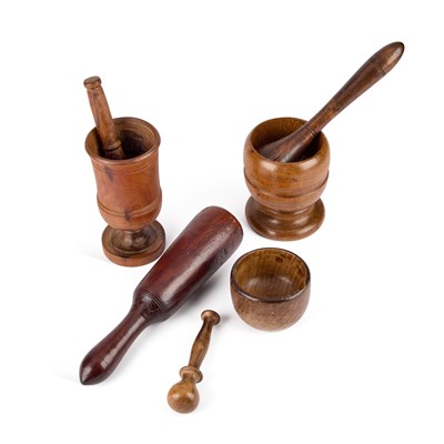 Lot 220 - A GROUP OF TREEN PESTLE AND MORTARS