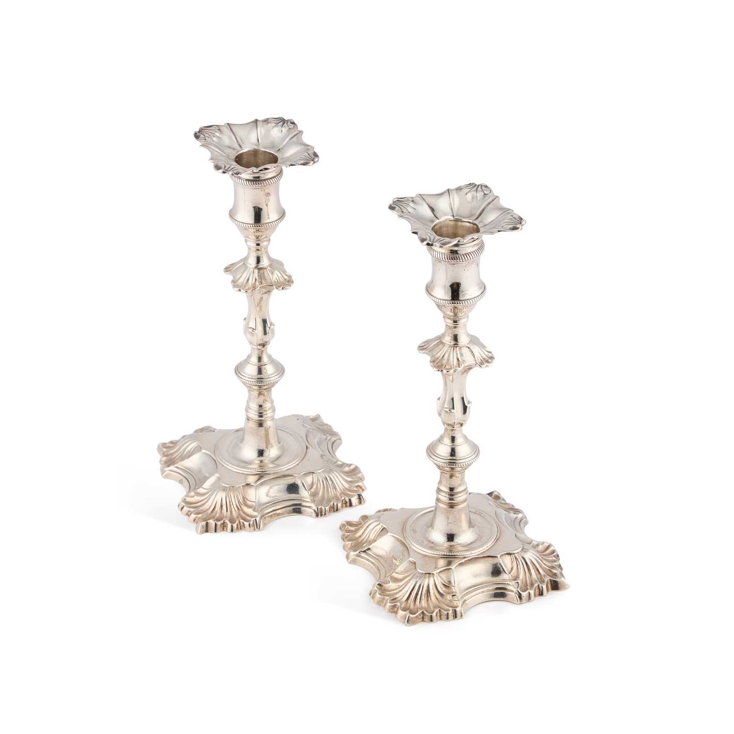 Lot 551 - A PAIR OF GEORGE II CAST SILVER CANDLESTICKS