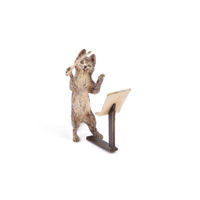 Lot 633 - A COLD-PAINTED BRONZE OF A CAT CONDUCTOR