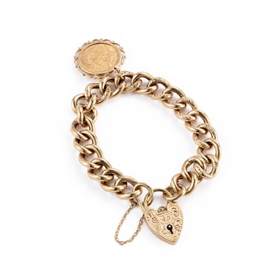 Lot 563 - A 9 CARAT GOLD FOLIATE ENGRAVED CURB LINK BRACELET WITH A HALF SOVEREIGN CHARM