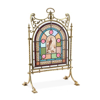 Lot 112 - AN EDWARDIAN BRASS, STAINED AND LEADED GLASS FIRESCREEN