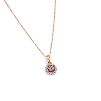 Lot 485 - A 9 CARAT GOLD RUBY AND DIAMOND CLUSTER PENDANT ON CHAIN