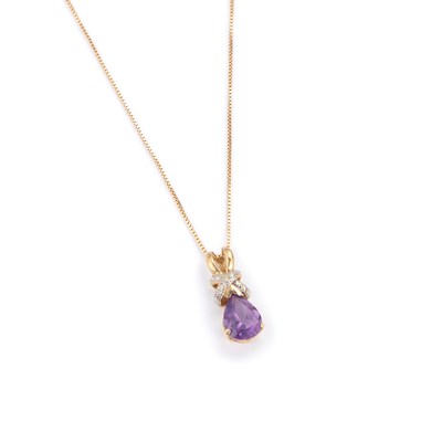 Lot 525 - A 9 CARAT GOLD AMETHYST AND DIAMOND PENDANT ON CHAIN