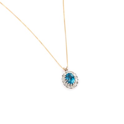 Lot 469 - A 9 CARAT GOLD BLUE TOPAZ AND DIAMOND PENDANT ON CHAIN