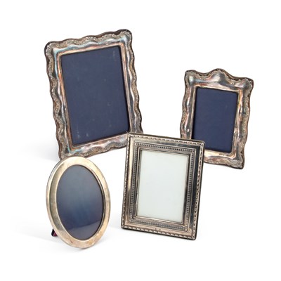 Lot 241 - FOUR MODERN SILVER-MOUNTED PHOTOGRAPH FRAMES