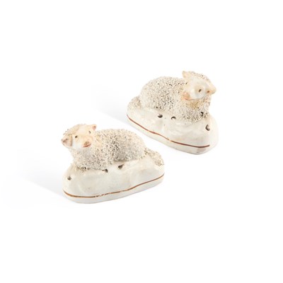 Lot 101 - A PAIR OF 19TH CENTURY STAFFORDSHIRE POTTERY MODELS OF SHEEP