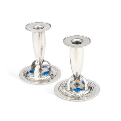 Lot 129 - ARCHIBALD KNOX (1864-1933) FOR LIBERTY & CO, A PAIR OF TUDRIC PEWTER AND ENAMEL CANDLESTICKS